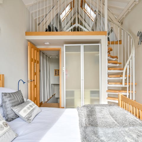 Climb the stairs in the master bedroom to the mezzanine and second bathroom