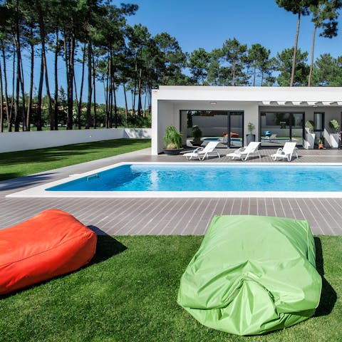 Soak up the Portuguese sun on a bean bag by the private pool