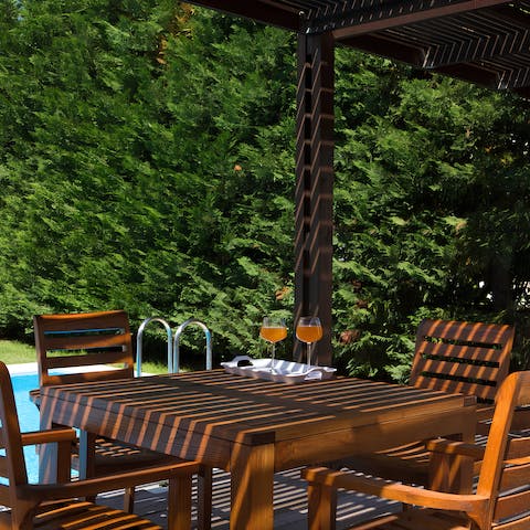 Dine alfresco in the shaded outdoor dining area – perfect with cocktails