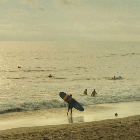 Catch some waves at the nearby Pantai Batu Belig beach