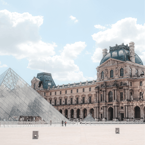 Take a fifteen-minute stroll through the streets of Paris to visit the iconic Louvre Museum