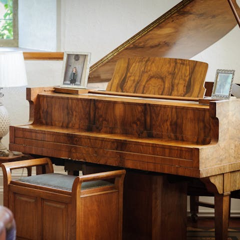 Impress your guests by playing a tune on the baby grand piano