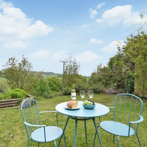 Enjoy the scenic views of Devon Hills from garden