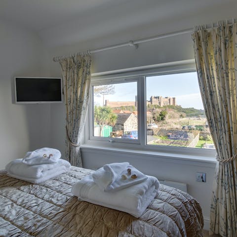 Wake up each morning in the main bedroom to unbeatable castle views