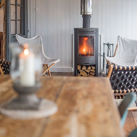 Curl up around the wood-burning stove after a day outdoors