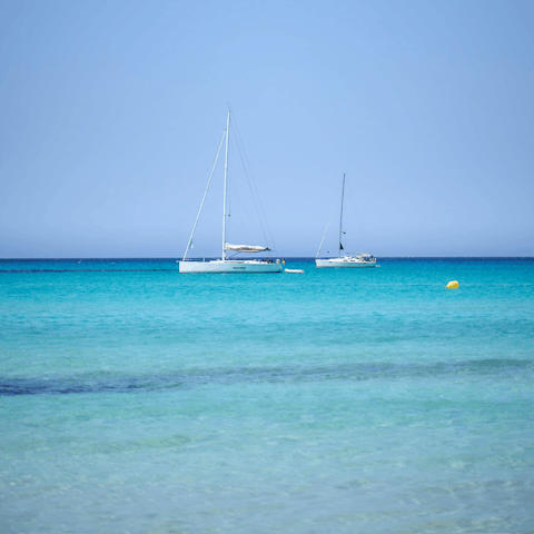 Spend the day lapping up the crystal clear waters at Es Trenc beach