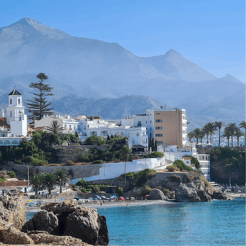Spend an afternoon strolling through the pretty streets of nearby Nerja  