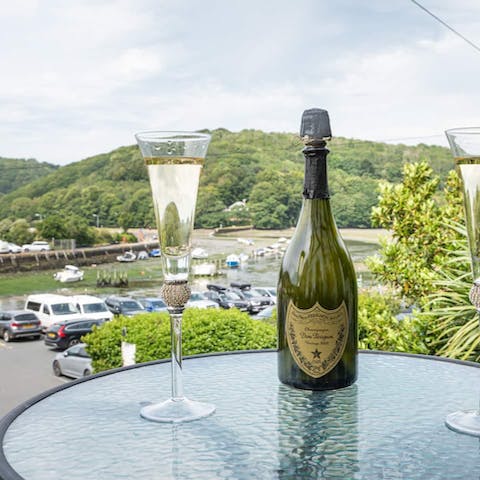 Enjoy a bottle of bubbly on the private terrace overlooking the water