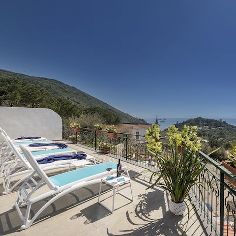 Spend blissful hours soaking up the sun on your terrace, overlooking the wildly beautiful view