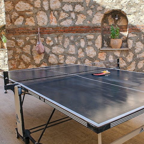 Fire up your competitive spirit playing table tennis and darts