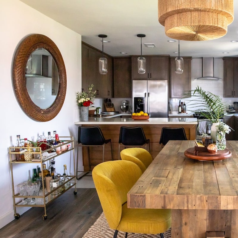 Mix up cocktails at the bar trolley and gather the group around the beautiful dining table