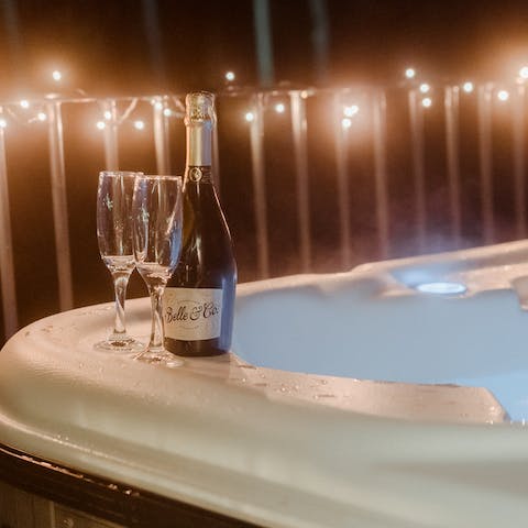 Treat yourself to a late-night glass of English fizz in the hot tub