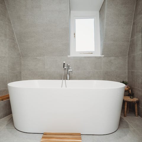 Savour a luxurious soak in the freestanding bathtub