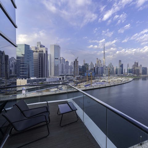 Gaze out over Downtown Dubai and the towering Burj Khalifa from the private balcony