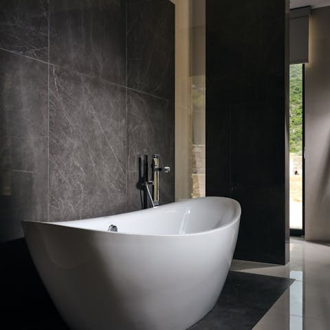 Unwind after a long afternoon with a soak in the sumptuous bathtub