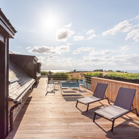 Take to the roof terrace for drinks with picture-perfect sea views