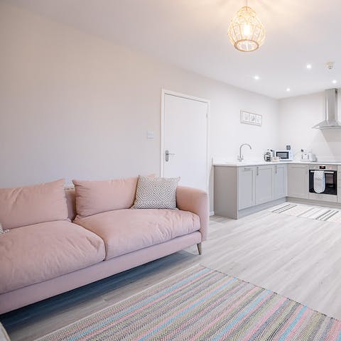 Stretch out in the living area after a hike in Sutton Hoo, an eleven-minute drive away
