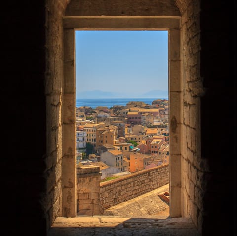 Explore Corfu's atmospheric Old Town, a thirteen-minute drive away