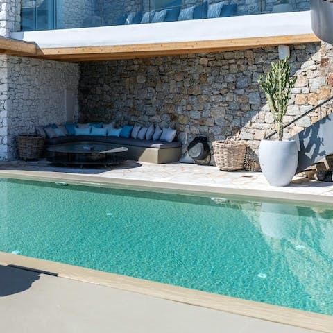 Get comfy by the glistening pool and soak up the Mediterranean sun