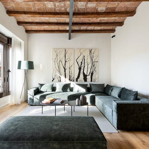 Relax in the sunny beamed living area with a glass of Spanish wine after a busy day of exploring