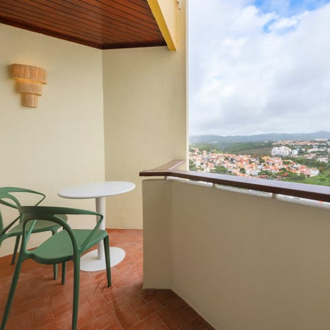 Take in the views over Cascais from your private balcony