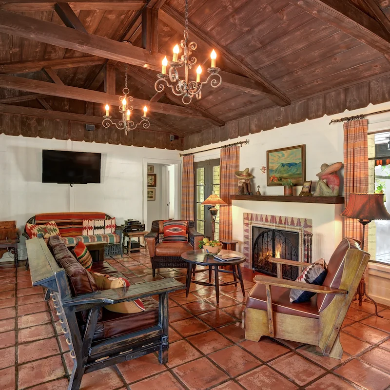 Gather guests around the wood burning fireplace at the end of the day
