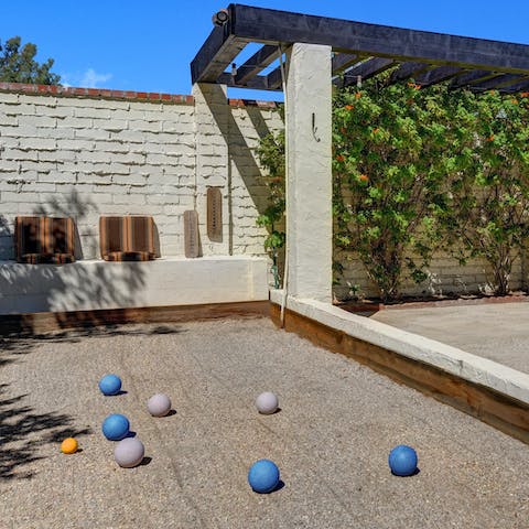 Get slightly addicted to bocce ball on the home's court