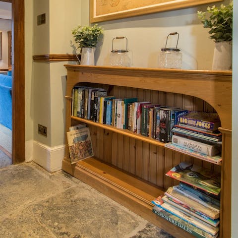 Pick a book or a board game from the shelves throughout the house