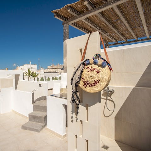 Cool off beneath blue skies in this refreshing outdoor shower