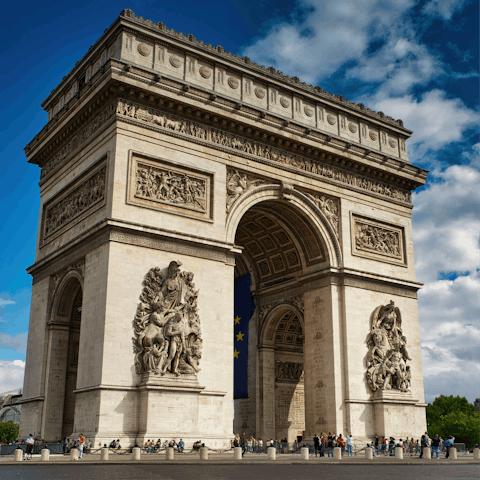 Visit the Arc de Triomphe, a quick metro ride away