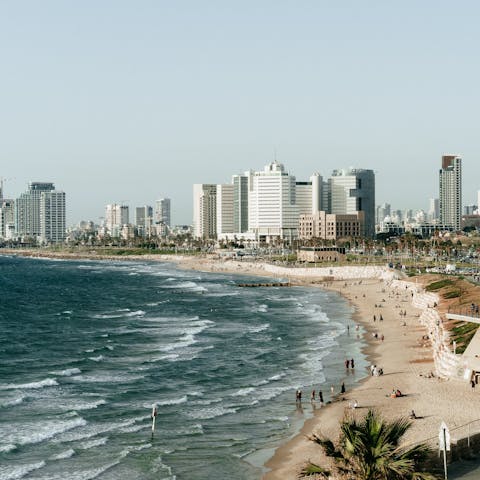 Take a stroll down to Gordon Beach and enjoy a swim in the sea