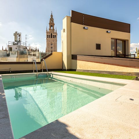 Take in the views of La Giralda from the shared rooftop pool