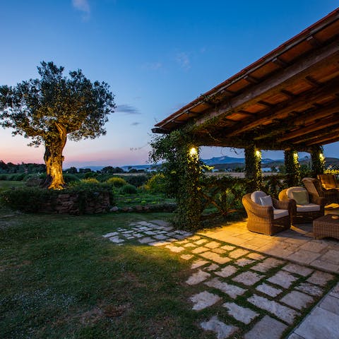 Chat the night away as the sun sets on the shaded terrace outdoors