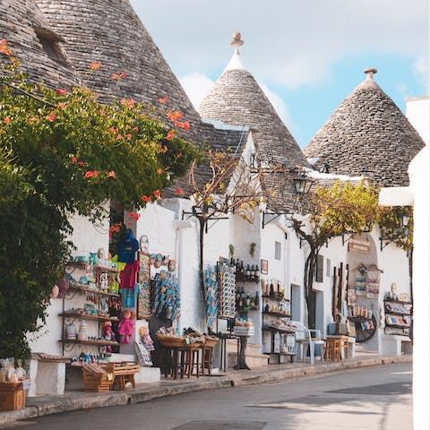 Marvel at the 15th century trulli buildings in Alberobello – just a half-hour drive away