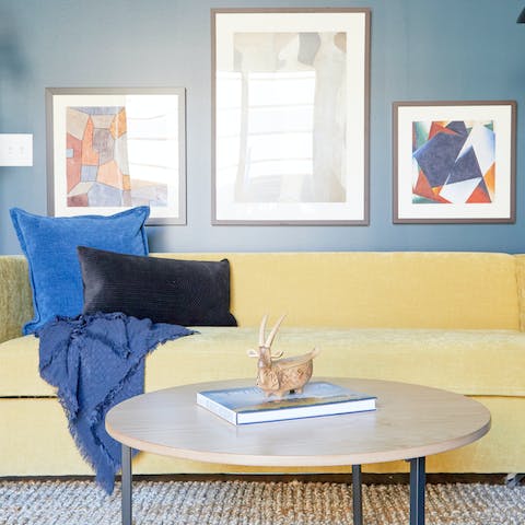 Sprawl out on the sumptuous yellow sofa and rest tired feet