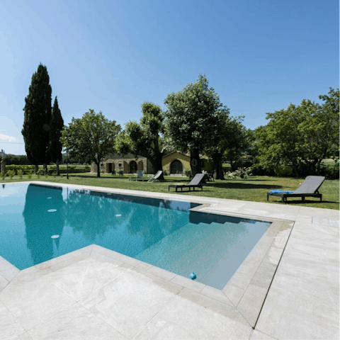 Pour yourself a glass of Chianti and unwind by the infinity pool