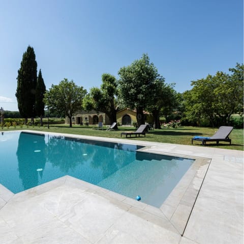Pour yourself a glass of Chianti and unwind by the infinity pool