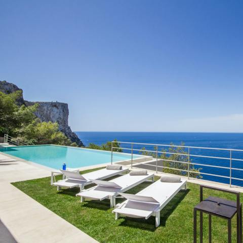 Swim to the edge of your heated infinity pool and gaze out over the Mediterranean Sea