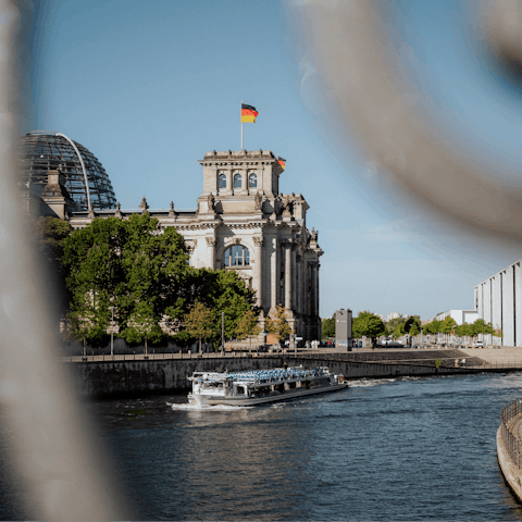 Stroll along the banks of the Spree, catching sight of the landmarks as you go