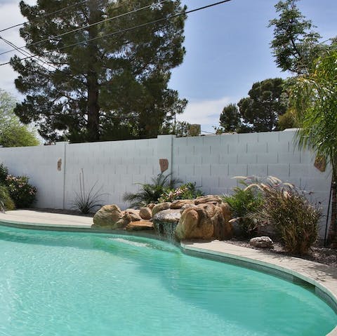 Cool off and relax in the backyard pool