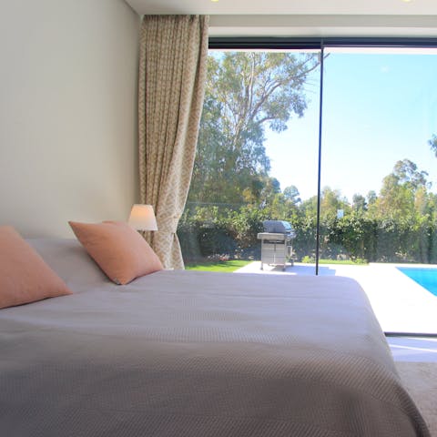 Slide open the glass doors and bask in a gentle breeze as you relax in the comfortable bed