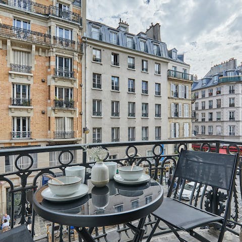 Sip coffee on the balcony while watching the bustling street below