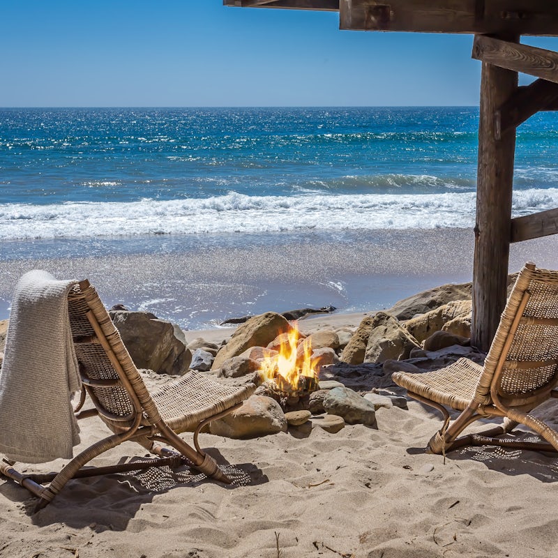 Toast marshmallows around the firepit on your private beach spot