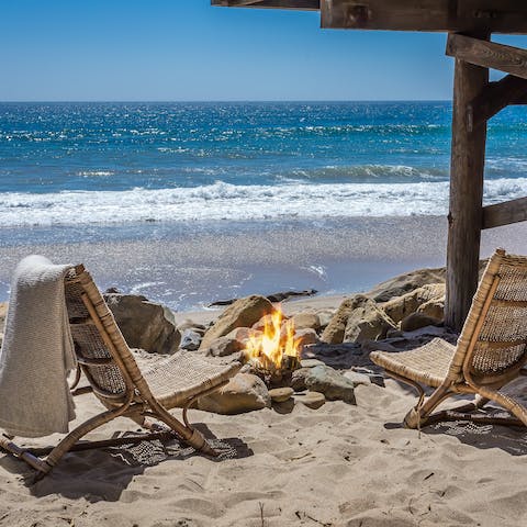 Toast marshmallows around the firepit on your private beach spot