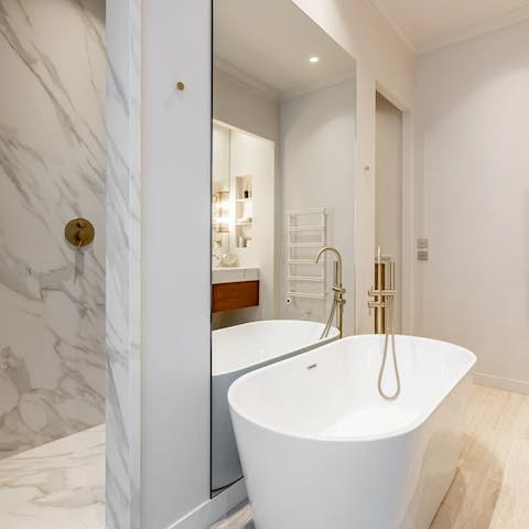 Relax in the freestanding tub after a day exploring the city