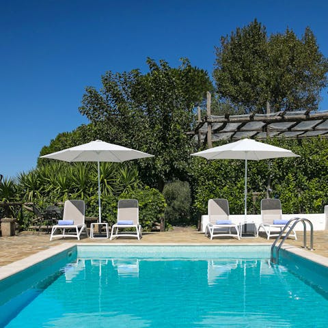 Soak up the sun poolside before slipping into the cooling waters of your pool