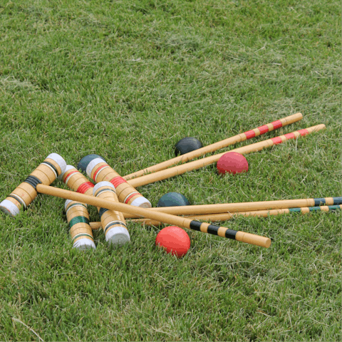 Unleash your competitive side with a game of croquet on the shared lawn