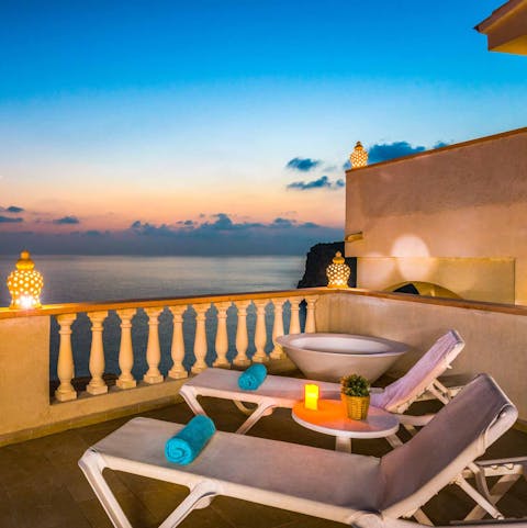 Lie back on a sun lounger and catch a spectacular sunset