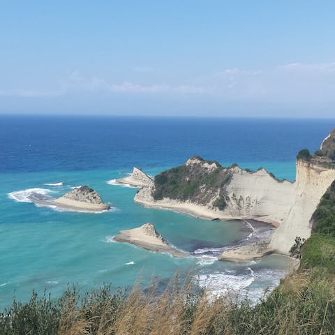 Explore Corfu's beautiful Dassia beach – only an eighteen-minute walk away