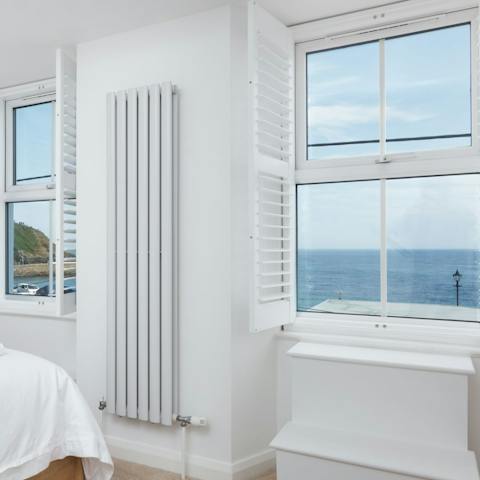 Take in uninterrupted sea views from the bedroom window